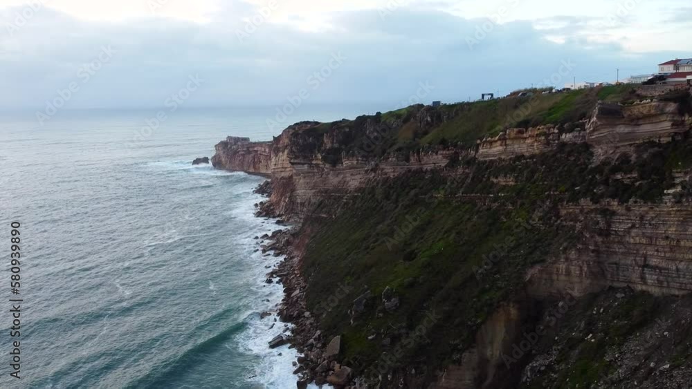Aerial View Of Nazare Viewpoint Cliff Edge In Portugal. Dolly Left, Speed Ramp Aerial View Of Nazare Viewpoint Cliff Edge In Portugal. Dolly Left, Speed Ramp