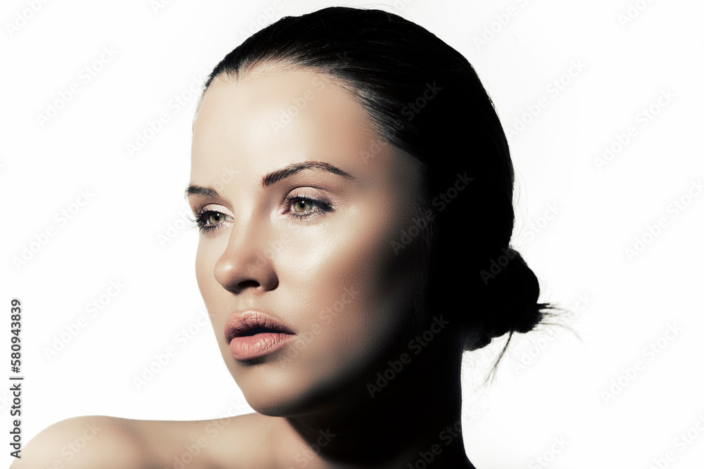 Light falling on woman face against white background Light falling on woman face against white background