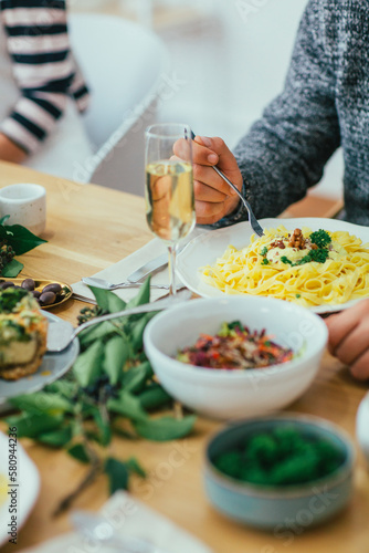 Wallpaper Mural Cropped image of friends having food at dining table Torontodigital.ca