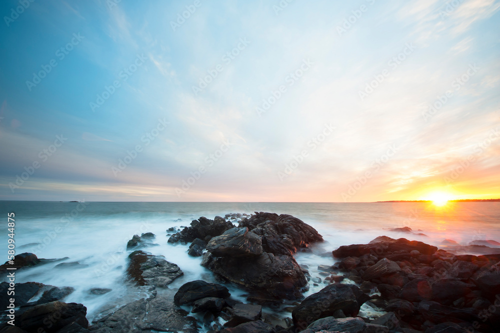 Scenic view of rocky shore during sunset Scenic view of rocky shore during sunset