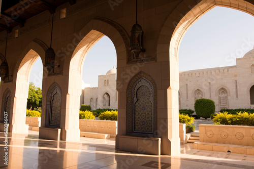 Arches at Sultan Qaboos Grand Mosque on sunny day photo