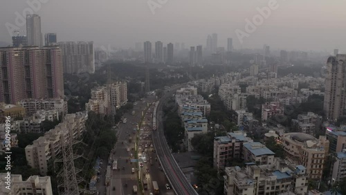 Wallpaper Mural Aerial View Of Mumbai Suburban Skyline With Moving Cars On Highway Road And A Train On Railway During Rush Hour. - Aerial Torontodigital.ca