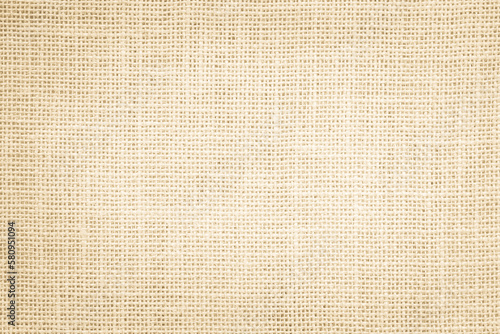 Jute hessian sackcloth canvas woven texture pattern background in light beige cream brown color blank empty photo