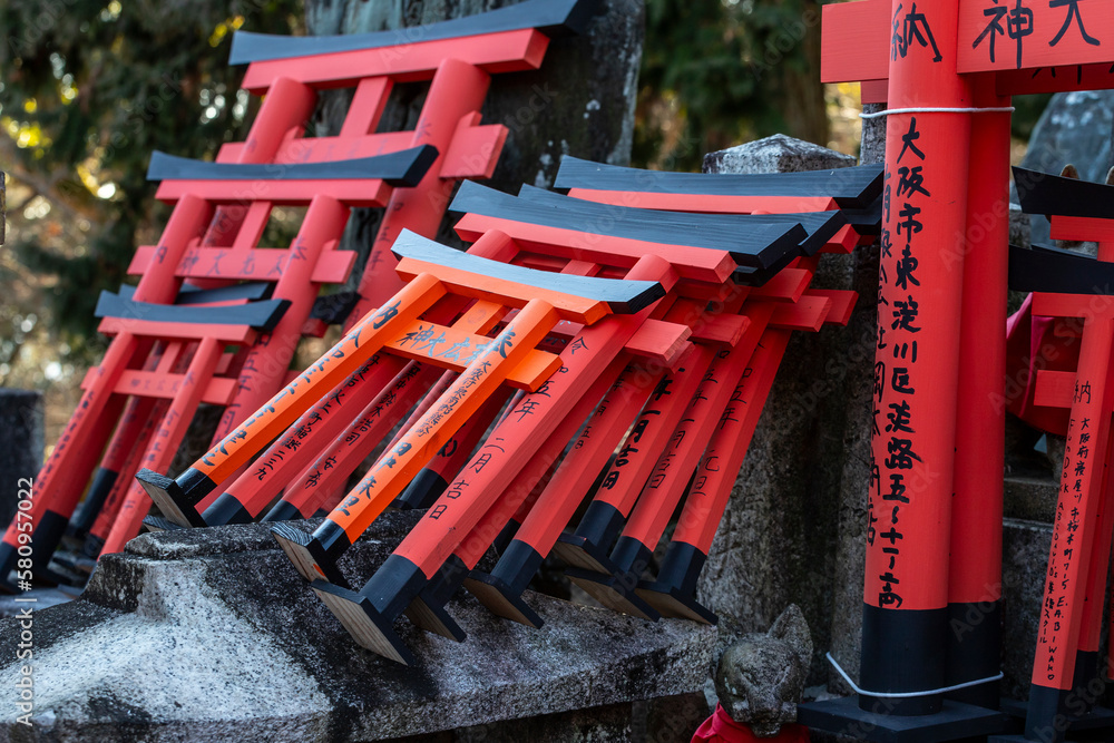 Red torii along a path at the Fushimi Inari shrine in Kyoto. Red torii along a path at the Fushimi Inari shrine in Kyoto.