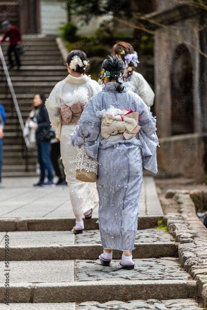 Japanese people dressed in kimono around Kyoto.