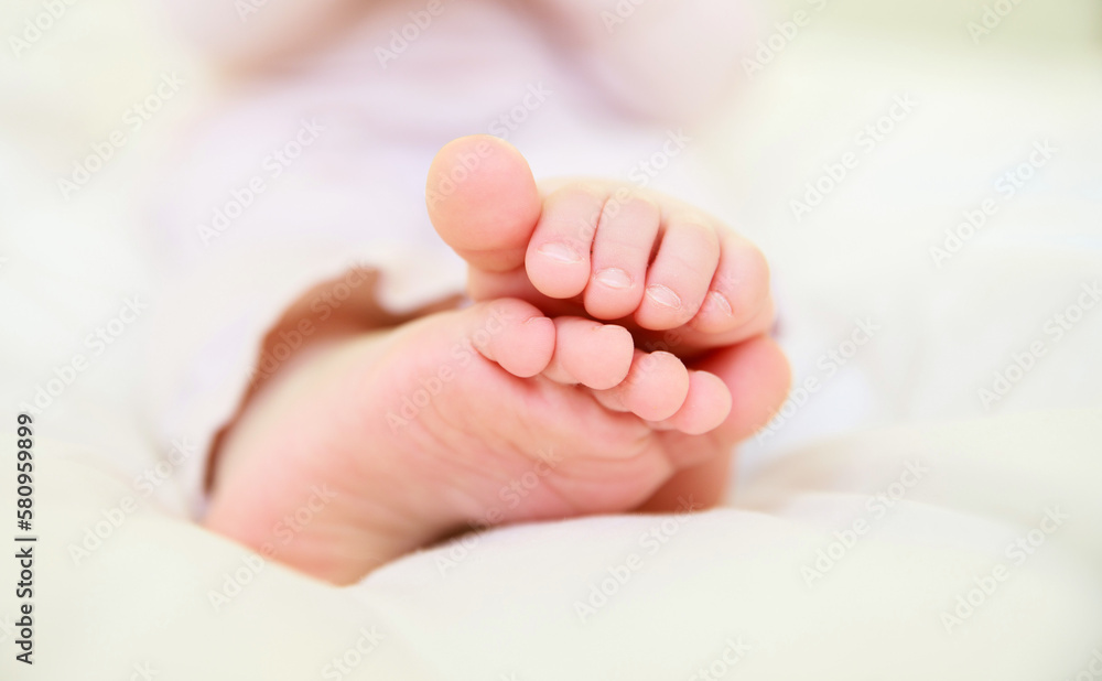 Children's legs close-up. Small feet with tiny toes. Newborn baby. Great childhood. Healthy lifestyle.
Children's legs close-up. Small feet with tiny toes. Newborn baby. Great childhood. Healthy lifestyle.