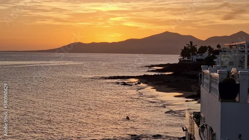 Sunset timelapse Puerto del Carmen at the coast of Lanzarote Spain photo