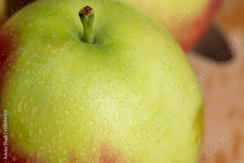 Fresh red and green apples on the kitchen table