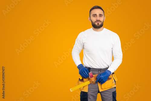 Young construction workers on a colored background © Angelov
