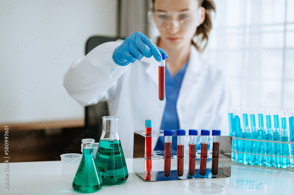 Female biotechnologist testing new chemical substances in laboratory. Female biotechnologist testing new chemical substances in laboratory.
