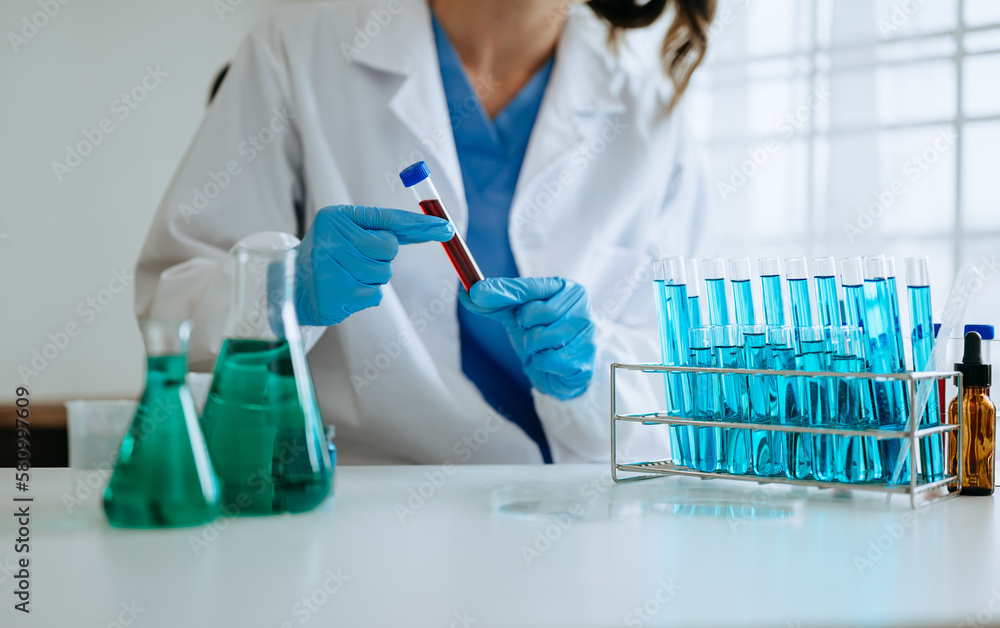 Female biotechnologist testing new chemical substances in laboratory. Female biotechnologist testing new chemical substances in laboratory.