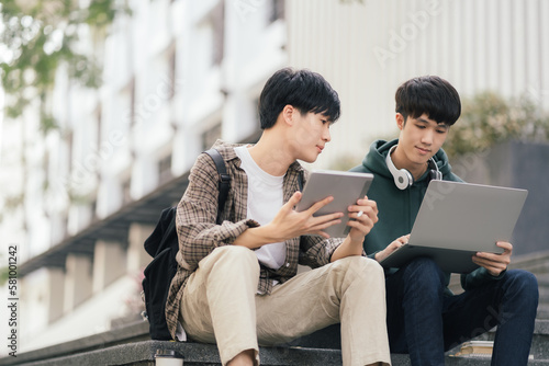 Students Reading Books In University Campus, summer vacation.