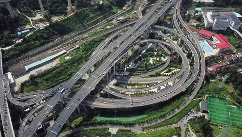 spinning aerial shot of the highway intersection and freeway bridges of Chongqing, Huangjuewan, China, daytime. photo