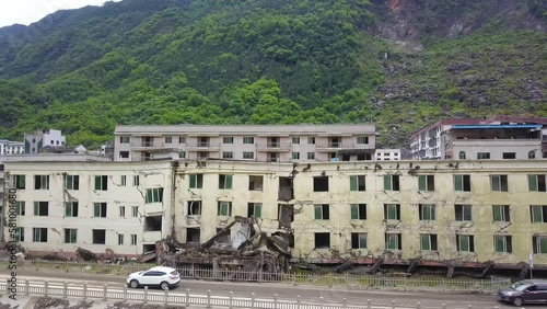 Broken homes and evacuating cars, the earthquake aftermath in Sichuan province of Lidung County, China.  photo