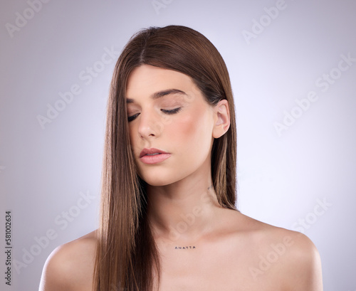 Beauty, face and hair care of woman with eyes closed in studio isolated on a background. Cosmetics, makeup skincare and female model with salon treatment for healthy keratin, balayage and hairstyle.