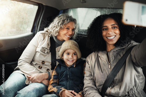 Selfie, smile and family on a road trip in a car for bonding, quality time and a getaway together. Happy, travel and mother, grandmother and a child taking a photo on vacation for social media
