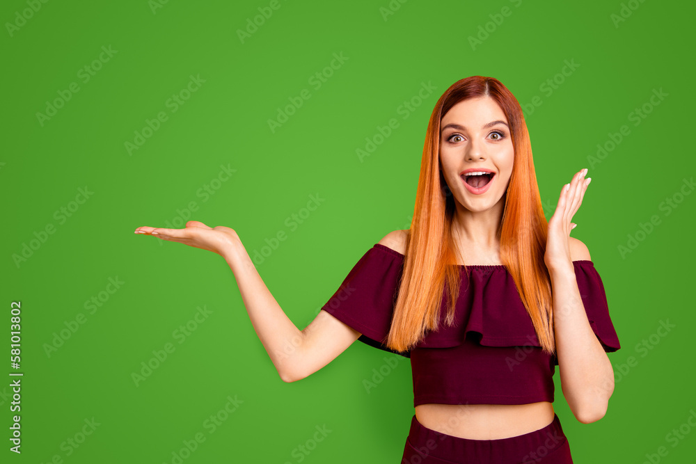 Omg wow unbelievable It takes first place in rating Closeup photo portrait of beautiful funny funky fancy with opened mouth lady holding empty copy space over palm isolated bright vivid background Omg wow unbelievable It takes first place in rating Closeup photo portrait of beautiful funny funky fancy with opened mouth lady holding empty copy space over palm isolated bright vivid background