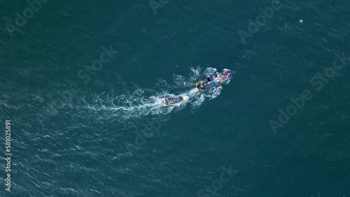 Wallpaper Mural Aerial Birds Eye View Of Motorised Fishing Boat Sailing Across Waters Off Chile With Birds Flying Overhead. Tracking Shot Torontodigital.ca