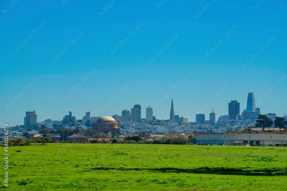 Outdoor park and recreation area on lawn overlooking downtown historic districts of san francisco california in sunlight