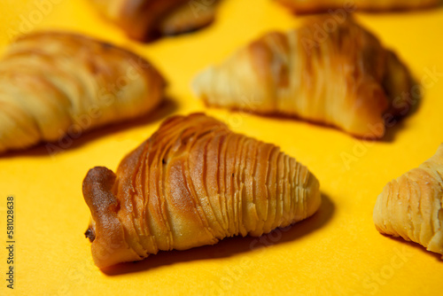 Close-up of Neapolitan Sfogliatelle, Traditional Italian puff pastry desserts with ricotta cheese filling. Sweet fragrant background for advertising Cafes, Banks and Insurance companies. Banner