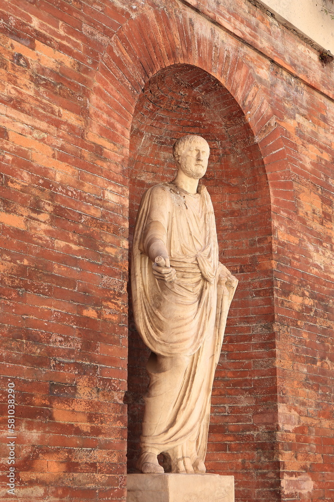 Brick Wall and Niche with White Roman Statue at the Quirinal Hill in Rome, Italy Brick Wall and Niche with White Roman Statue at the Quirinal Hill in Rome, Italy