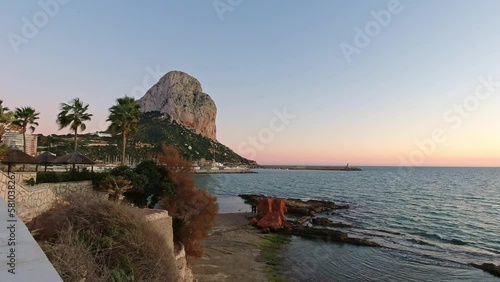 Penya D Ifac Calpe Spain sunset from the seafront plaza, a nice walk on a spring evening photo