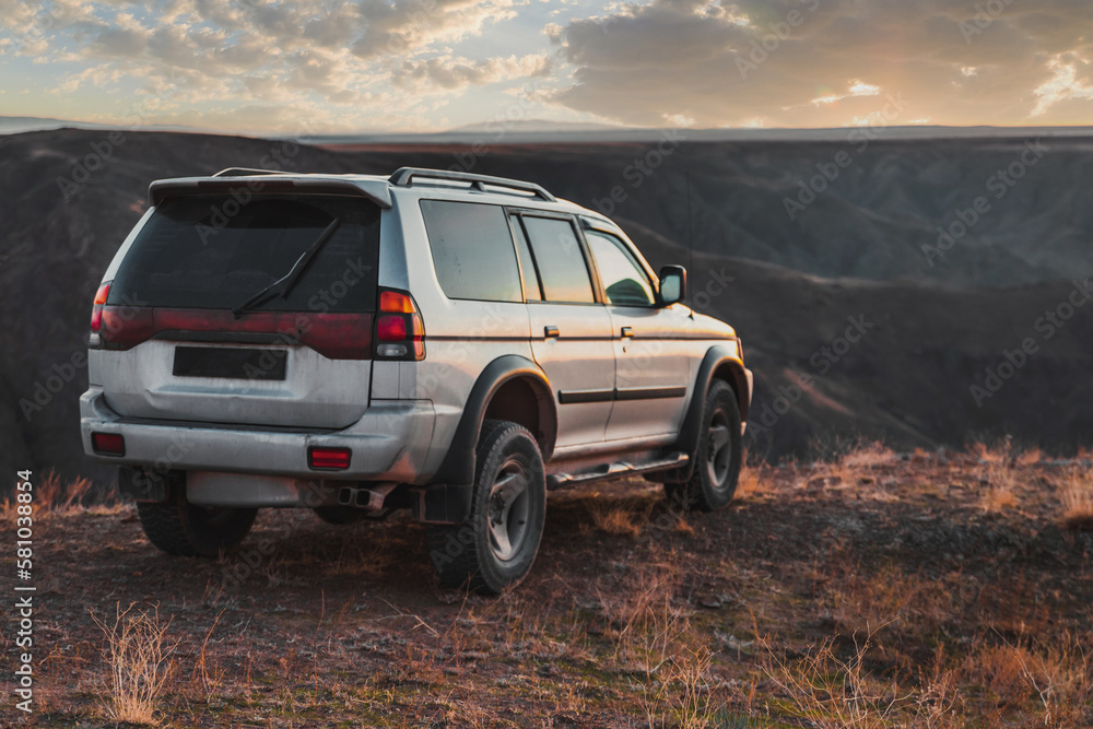 SUV crossover car at sunset. Travel and journey 4wd car. SUV crossover car at sunset. Travel and journey 4wd car.