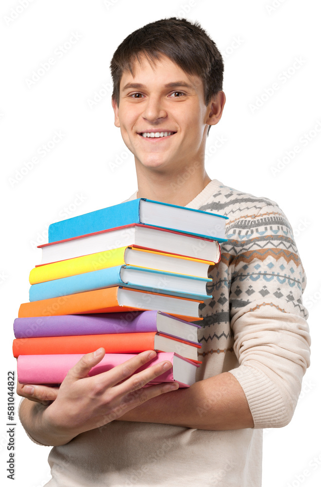 Young man carrying a stack of textbooks Young man carrying a stack of textbooks