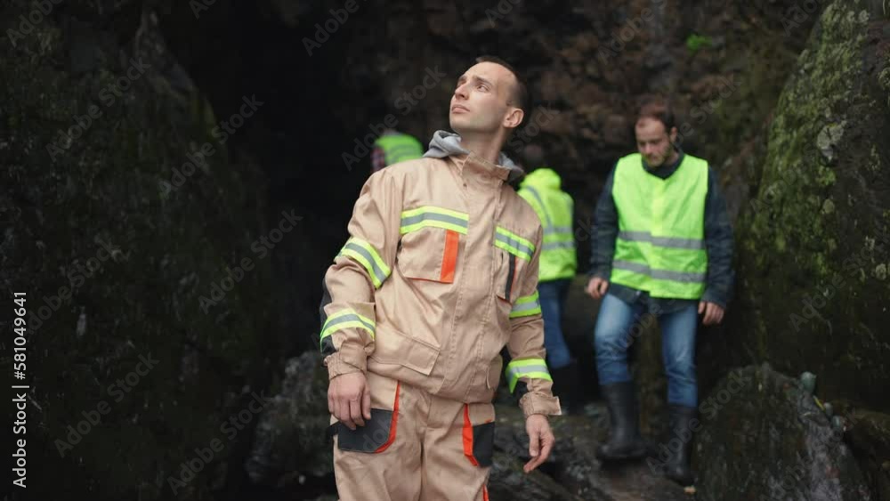 portrait of a male rescuer in uniform searching for missing persons in the mountains or the aftermath of an earthquake portrait of a male rescuer in uniform searching for missing persons in the mountains or the aftermath of an earthquake