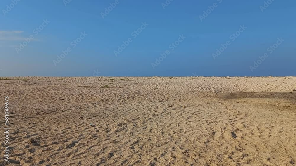 white gravel sand desert with a bright blue cloud as a background white gravel sand desert with a bright blue cloud as a background
