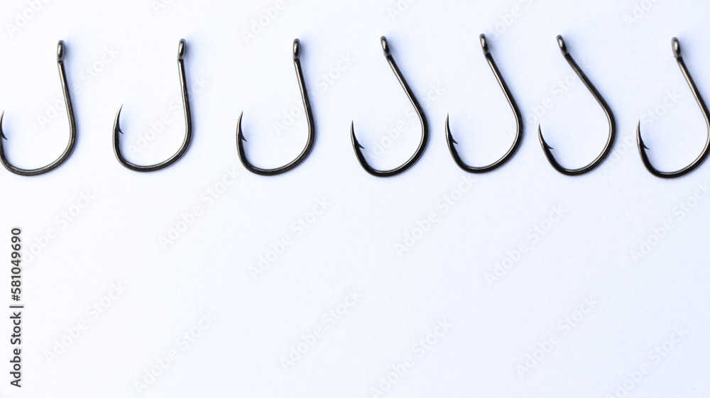 close up shot of fish hook on white background close up shot of fish hook on white background