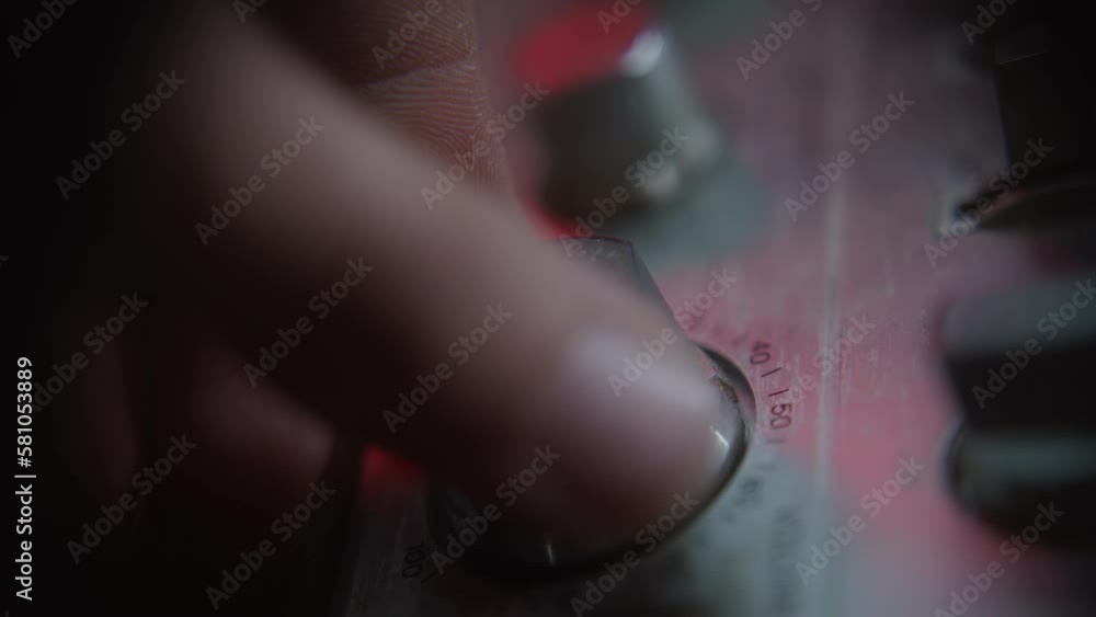 Macro Close-up Shot of Human Fingers Turning Volume Knob on Boombox Tape Player Macro Close-up Shot of Human Fingers Turning Volume Knob on Boombox Tape Player