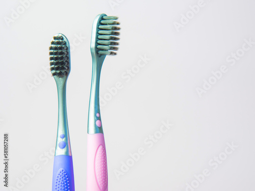 black toothbrush on pastel background closeup