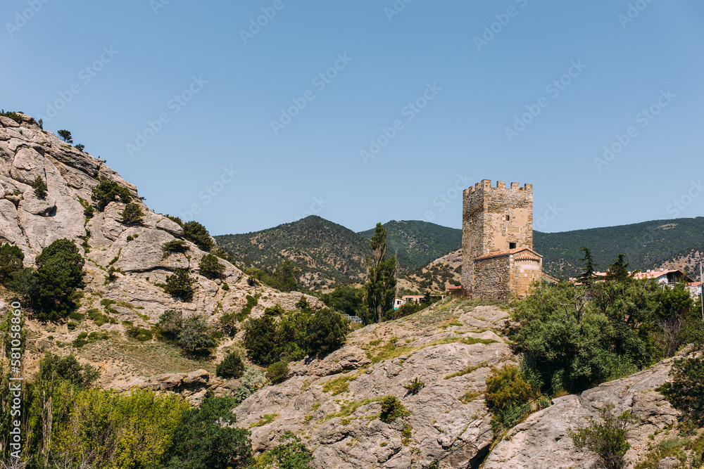  Beautiful summer landscape - view of the mountains and the ancient fortress