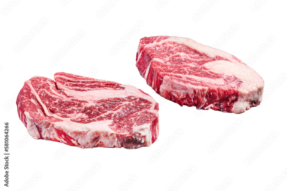 Raw chuck eye roll steaks, premium beef meat on a butcher board.  Isolated, transparent background.