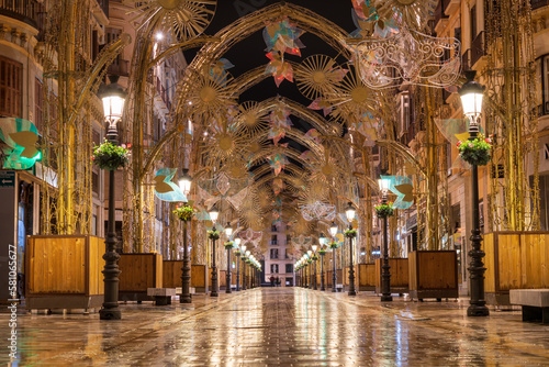 Carnival Decorations Along Promenade in Spain with Festive Street Lights.

