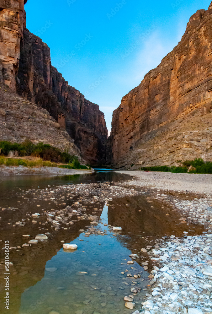 Cliffs rise steeply from Rio Grande River. A view of Santa Elena Canyon in Big Bend National Park.