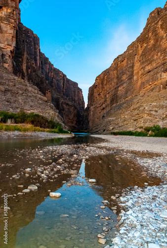 Cliffs rise steeply from Rio Grande River. A view of Santa Elena Canyon in Big Bend National Park.