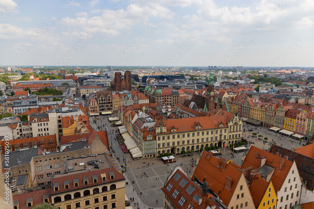 Top aerial view of Wroclaw. City center with colorful houses with red roofs and square, Poland