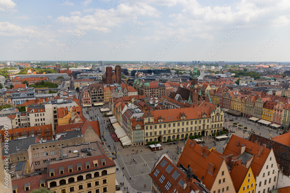 Top aerial view of Wroclaw. City center with colorful houses with red roofs and square, Poland Top aerial view of Wroclaw. City center with colorful houses with red roofs and square, Poland