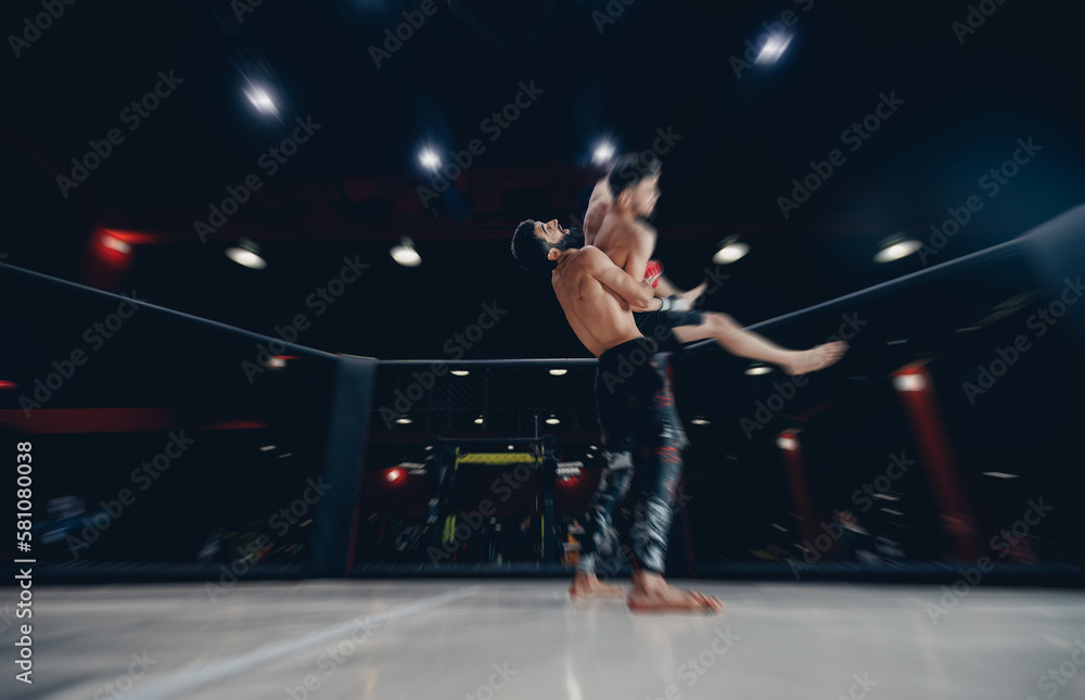 Fototapeta premium Two man MMA boxers fighters in fights without rules in ring octagon, dark background, motion blur