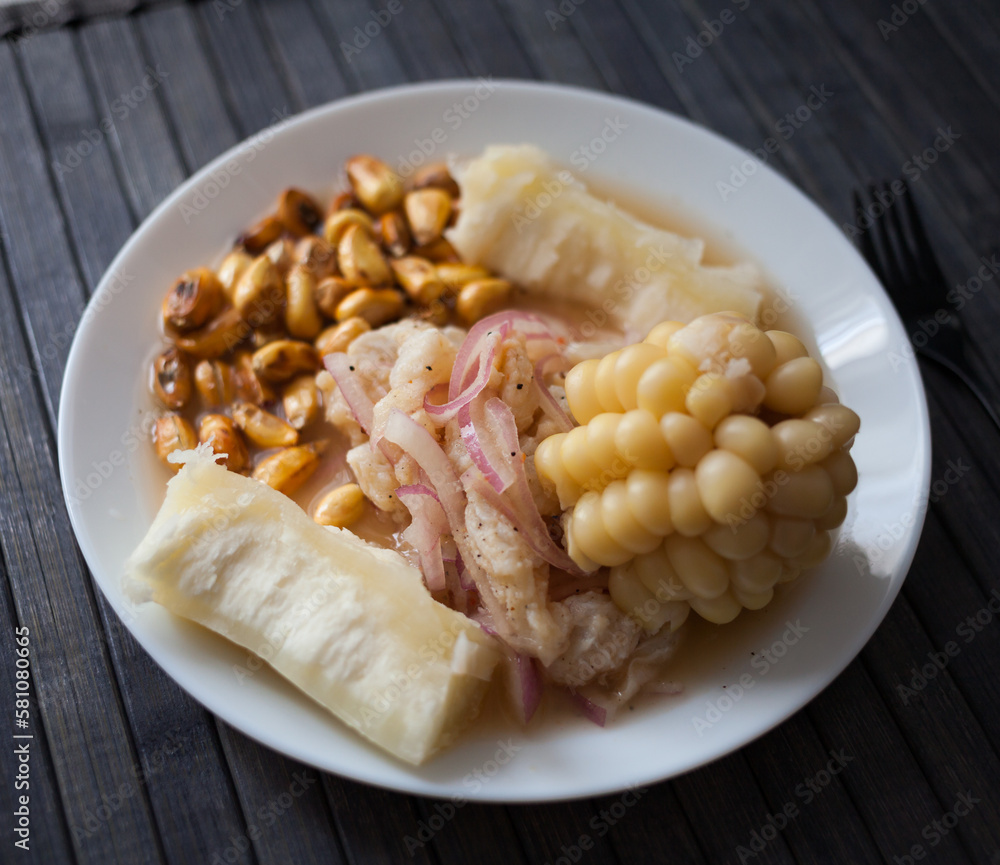Peruvian traditional dish.fish ceviche with yuka and corn Stock Photo