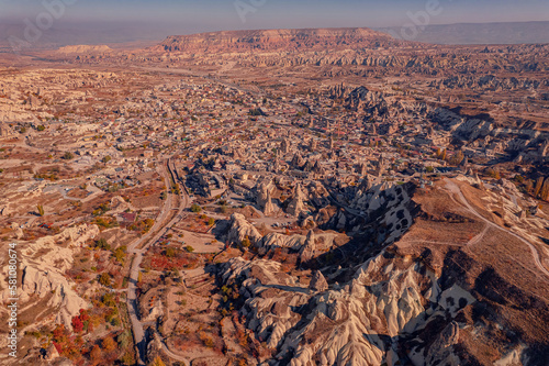 Panoramic view of Goreme national park with over deep canyons, valleys sunset Cappadocia sunset, aerial top view drone