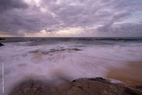 Oceanscape during the sunset with waves and rock, Ascension island.