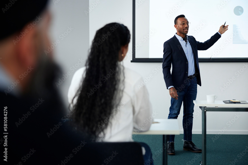 Businessman presenting before colleagues during meeting Businessman presenting before colleagues during meeting