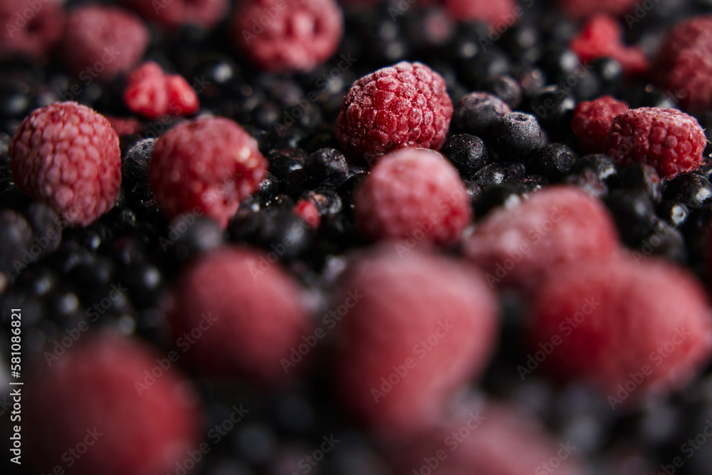 Close-up of pile of raspberries and blackcurrants Close-up of pile of raspberries and blackcurrants