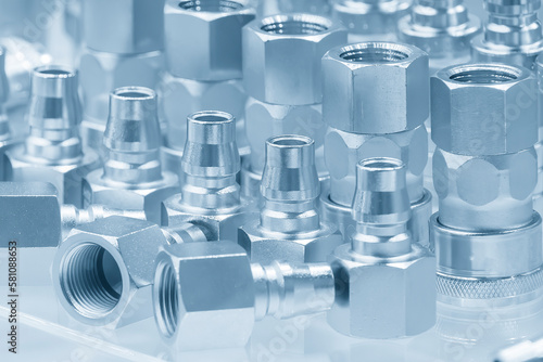 Close up scene quick release  coupling connector fitting parts in the light blue scene.