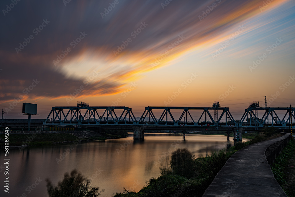 Naklejka premium High-speed railway bridge at dusk.
