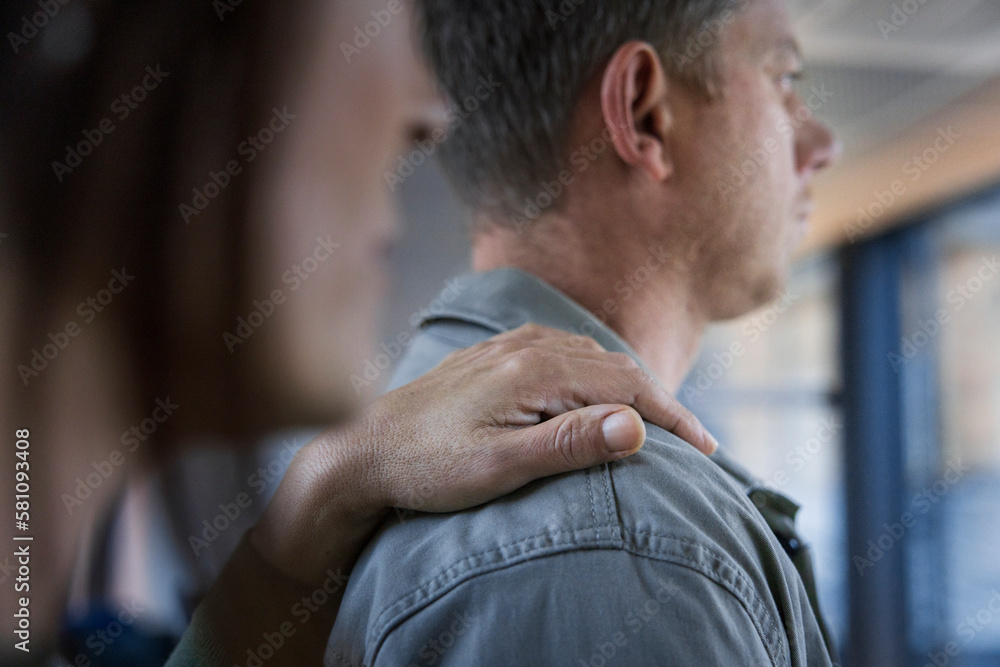 Mature woman touching man's arm Mature woman touching man's arm
