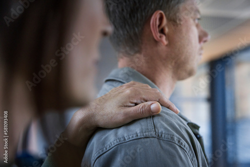 Mature woman touching man's arm